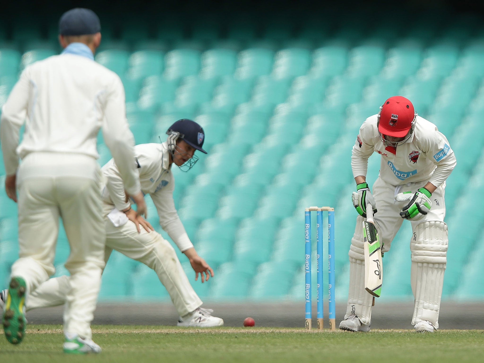 Hughes immediately reacts to being hit on the head