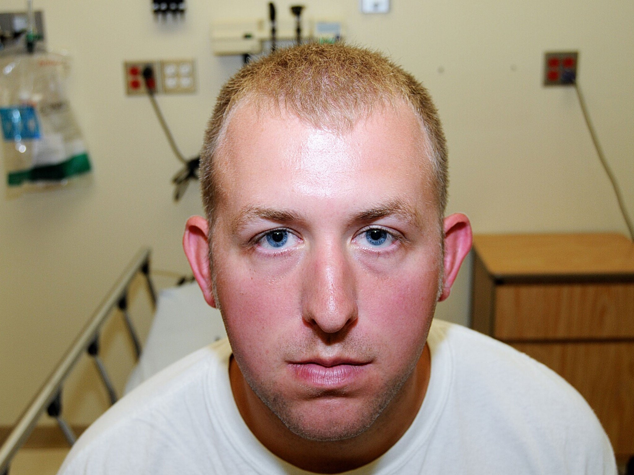 Ferguson police officer Darren Wilson during his medical examination after he fatally shot Michael Brown, in Ferguson