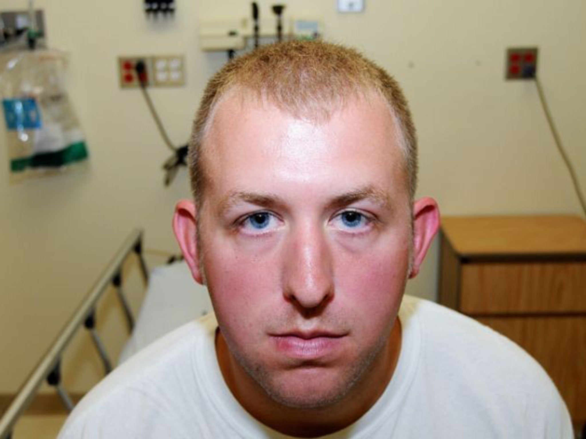 This photo released by the St. Louis County Prosecuting Attorney's office on Monday 24 November, 2014, shows Ferguson police officer Darren Wilson during his medical examination after he fatally shot Michael Brown in Ferguson, Missouri