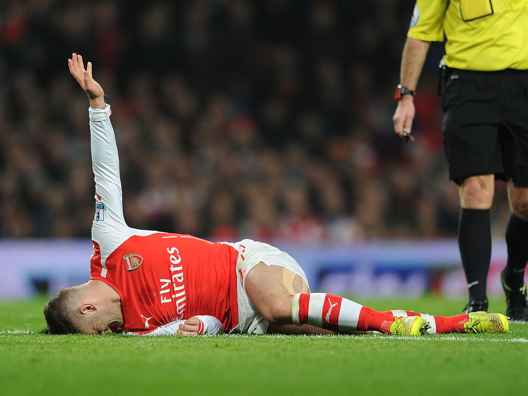 Jack Wilshere calls for medical help after suffering an ankle injury