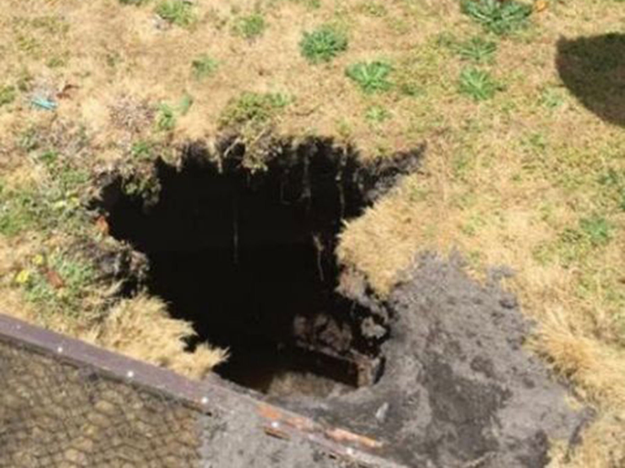 Sinkhole Filled With Water Swallows Australian Woman Hanging