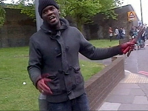 Michael Adebolajo brandishes the murder weapons after the killing of Drummer Lee Rigby in 2013