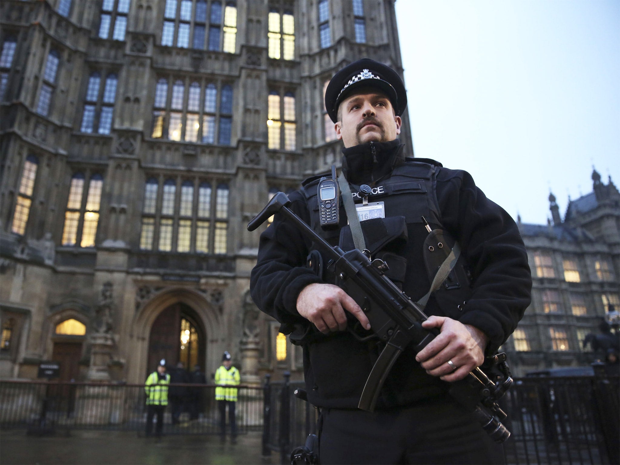 An armed police officer outside the Houses of Parliament
