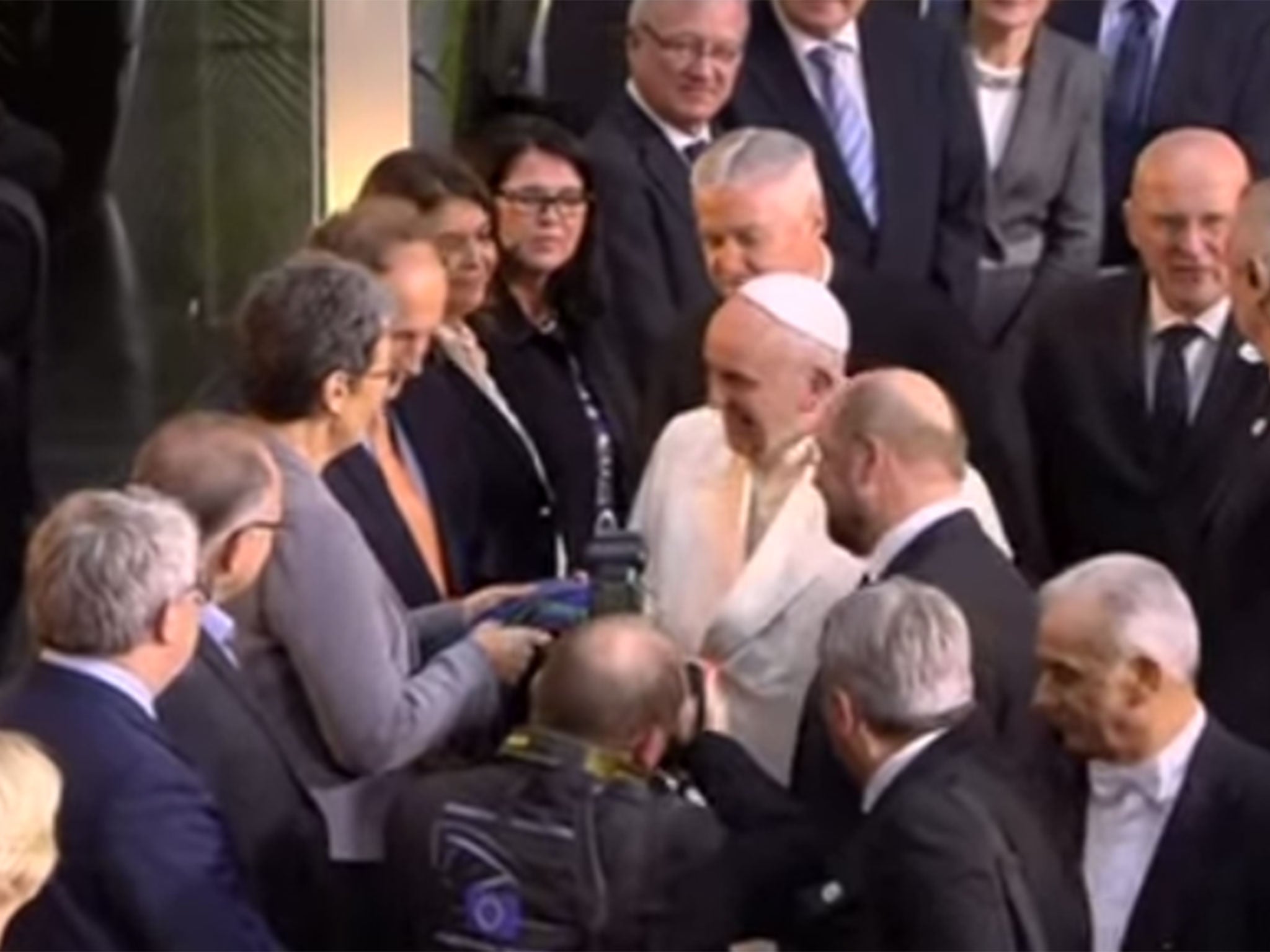 Ulrike Lunacek hands Pope Francis a rainbow scarf