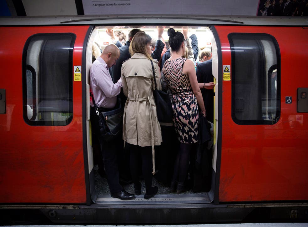 Hold tight: passengers on the London Underground