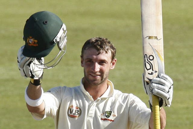 Hughes in Durban in 2009, celebrating the first of his two
centuries in the second Test against South Africa