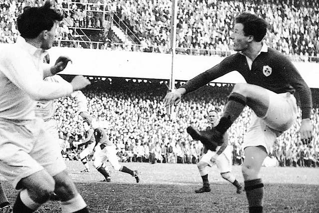 Kyle kicks from a scrum playing for Ireland against England at Lansdowne Road in 1949