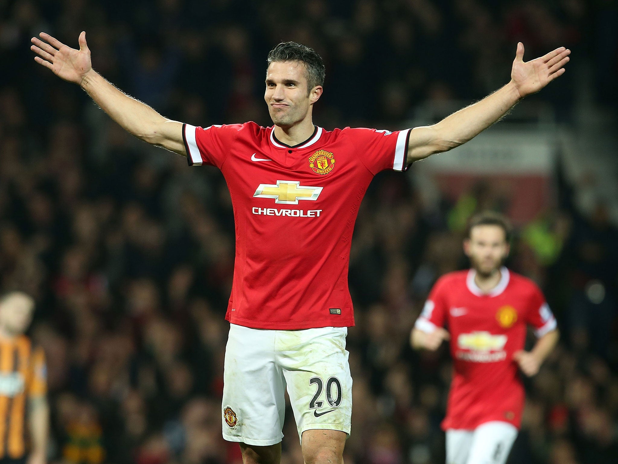 Robin van Persie celebrates his goal against Hull