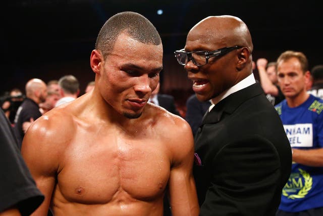 Chris Eubank Jr speaks with his father, Chris, after losing by a split decision to Billy Joe Saunders