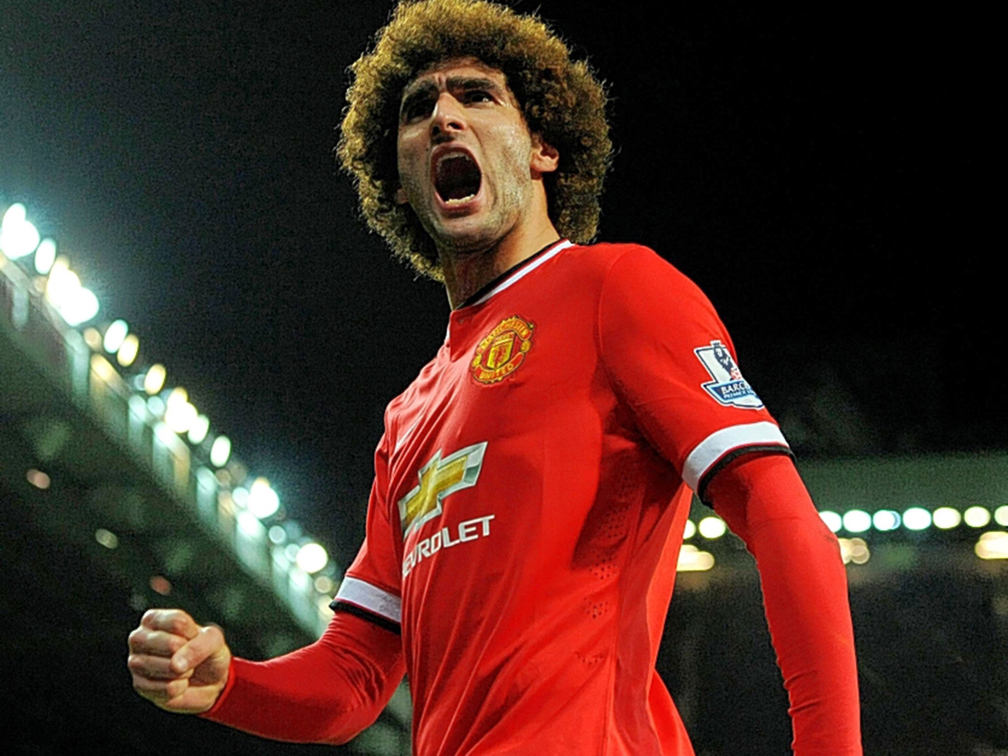 Manchester United’s Marouane Fellaini celebrates his goal against Stoke City on Tuesday night, his first in a competitive match at Old Trafford