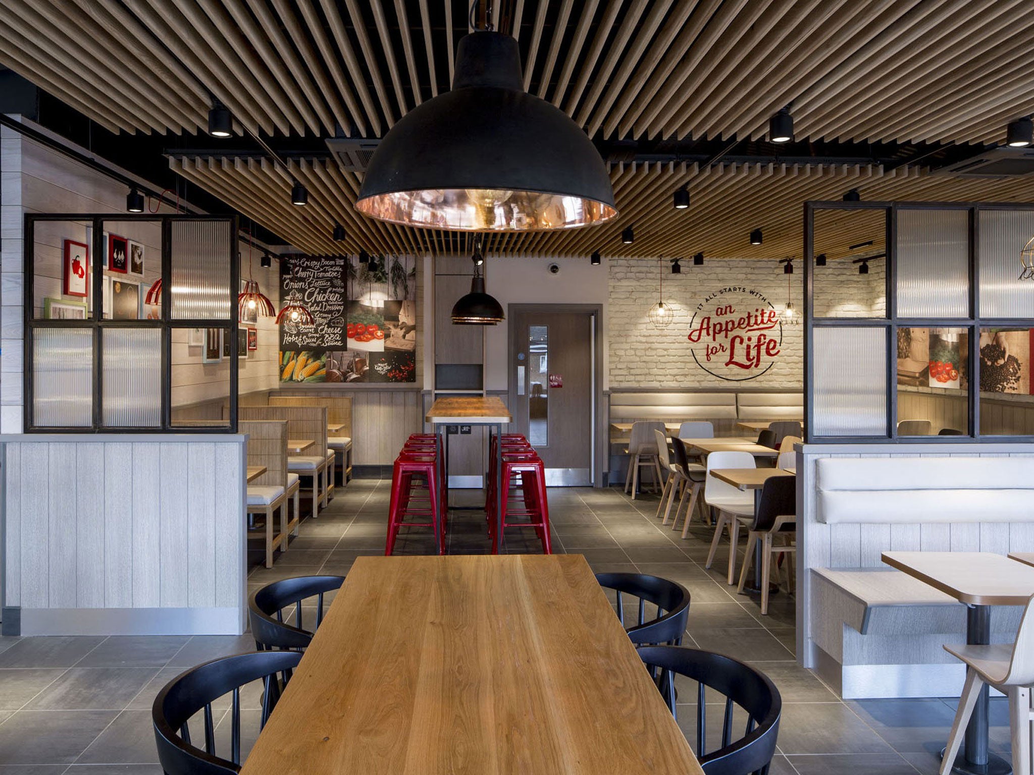 Hip with chips: KFC’s first redesigned branch, in Bracknell,
Berkshire. Other branches will also be made over next year