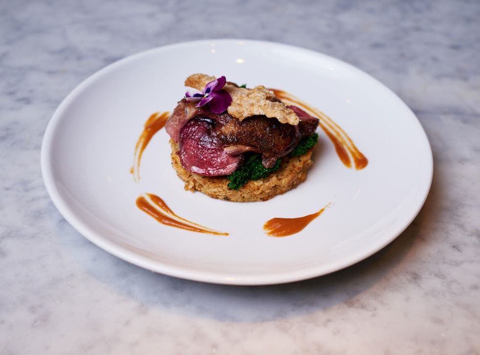 A pan-seared breast of wild mallard duck, celeriac rosti, saluteed kale, spiced cranberry and clementines at 'Pure Taste'