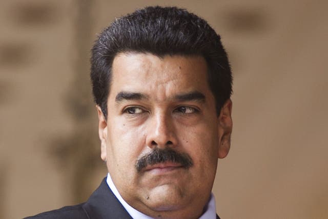 President Nicolas Maduro is accused of trying to silence government critics