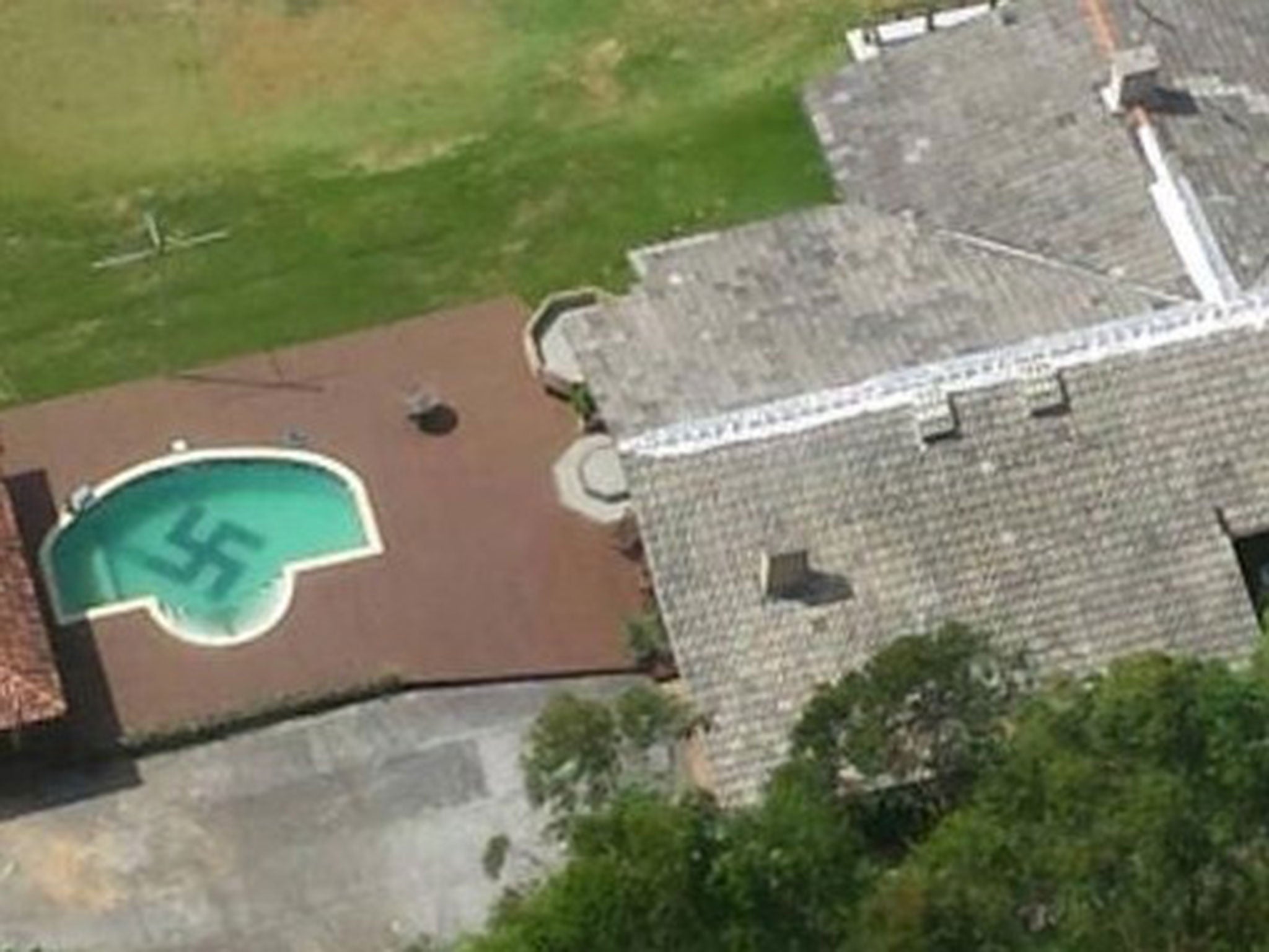 Police helicopter in Brazil spotted a huge swastika tiled into the bottom of a swimming pool