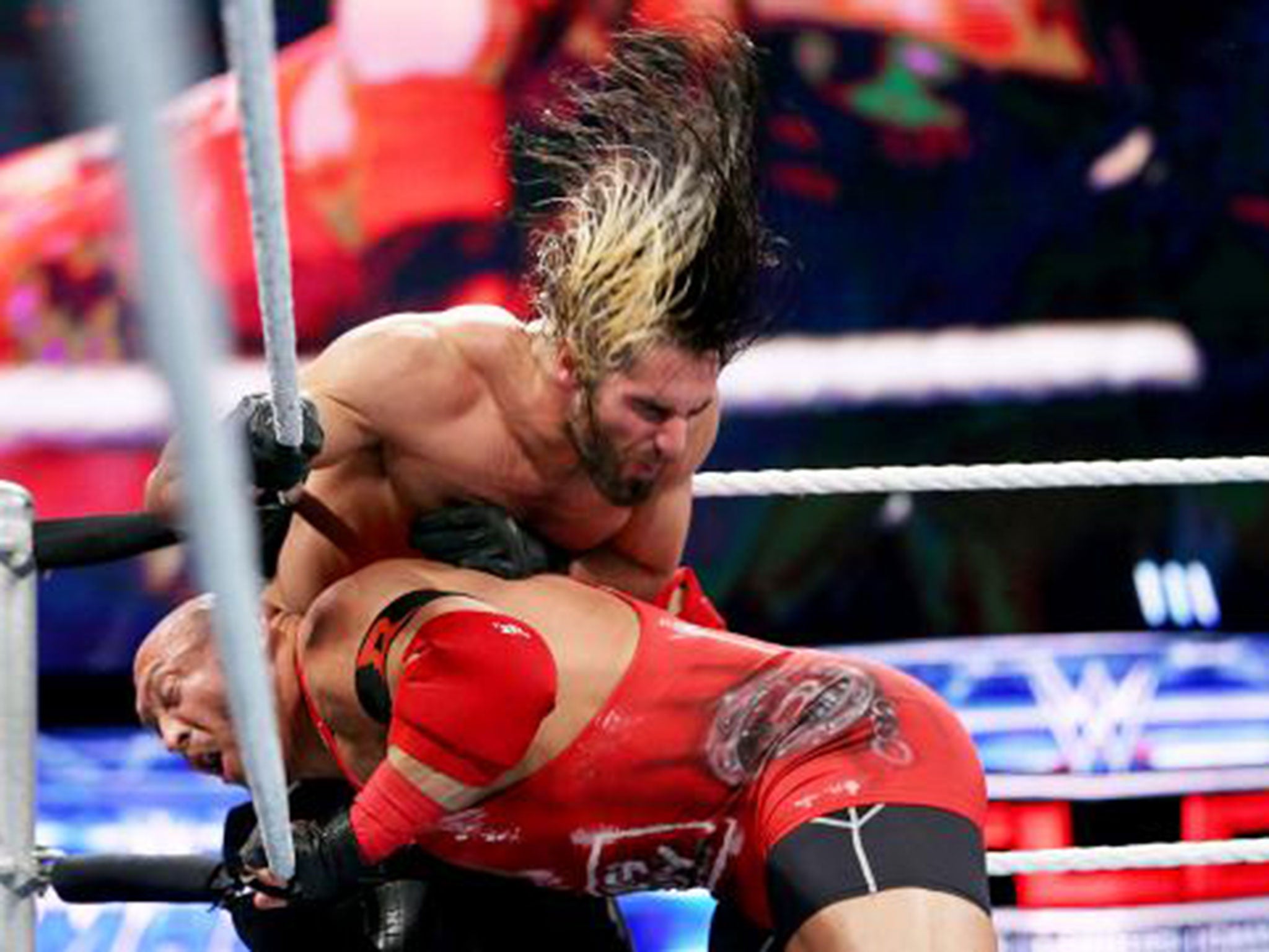 Ryback hits Seth Rollins with a shoulder to the gut