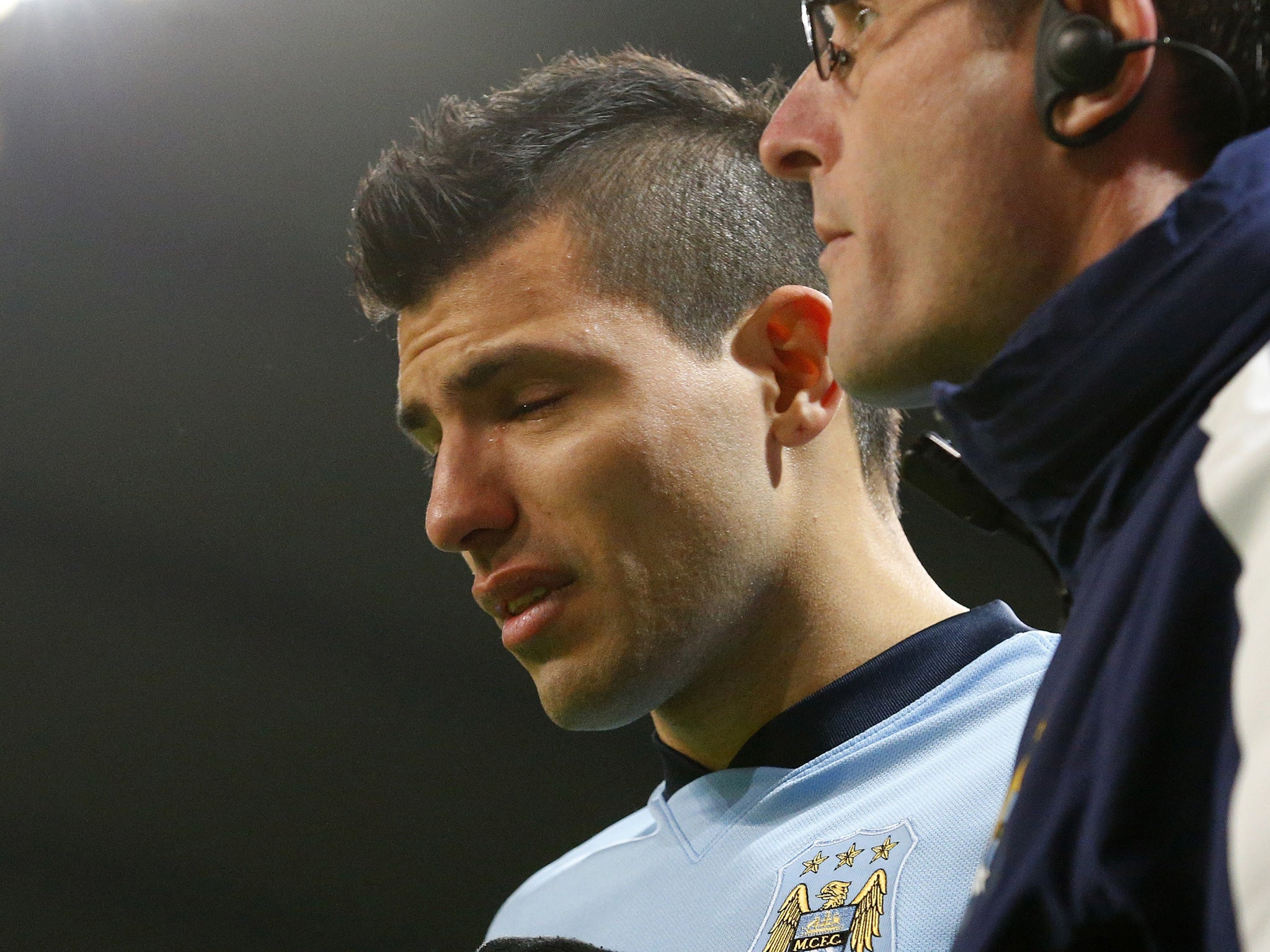 Sergio Aguero in tears as he leaves the pitch injured
