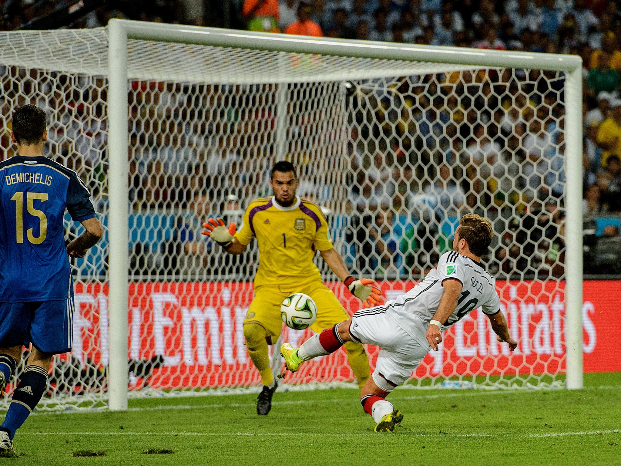 Mario Gotze volleys past Sergio Romero to score the winner in the World Cup final