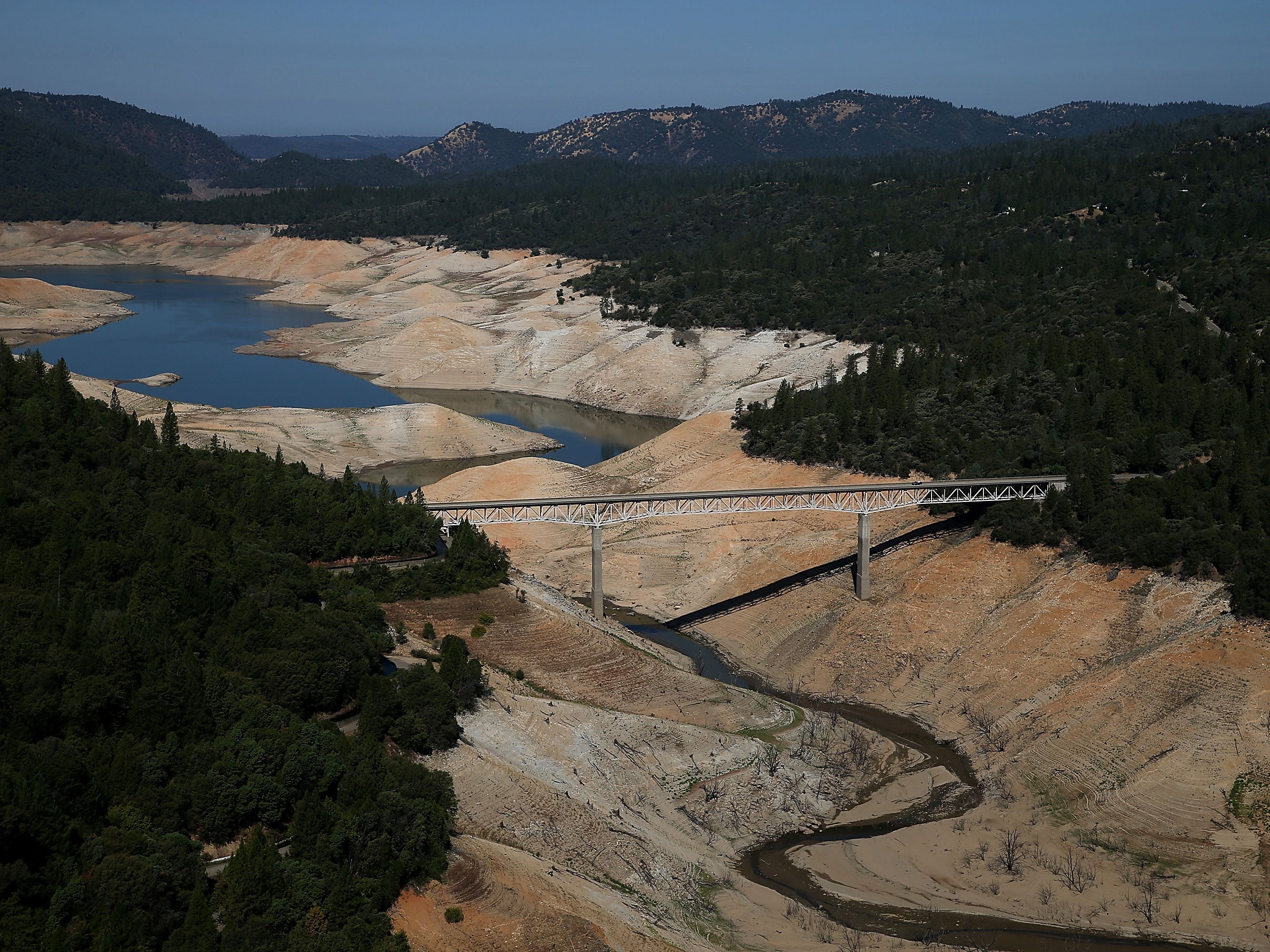 The Enterprise Bridge passes over a section of Lake Oroville that is nearly dry on August 19, 2014 in Oroville, California