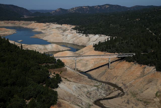The Enterprise Bridge passes over a section of Lake Oroville that is nearly dry on August 19, 2014 in Oroville, California