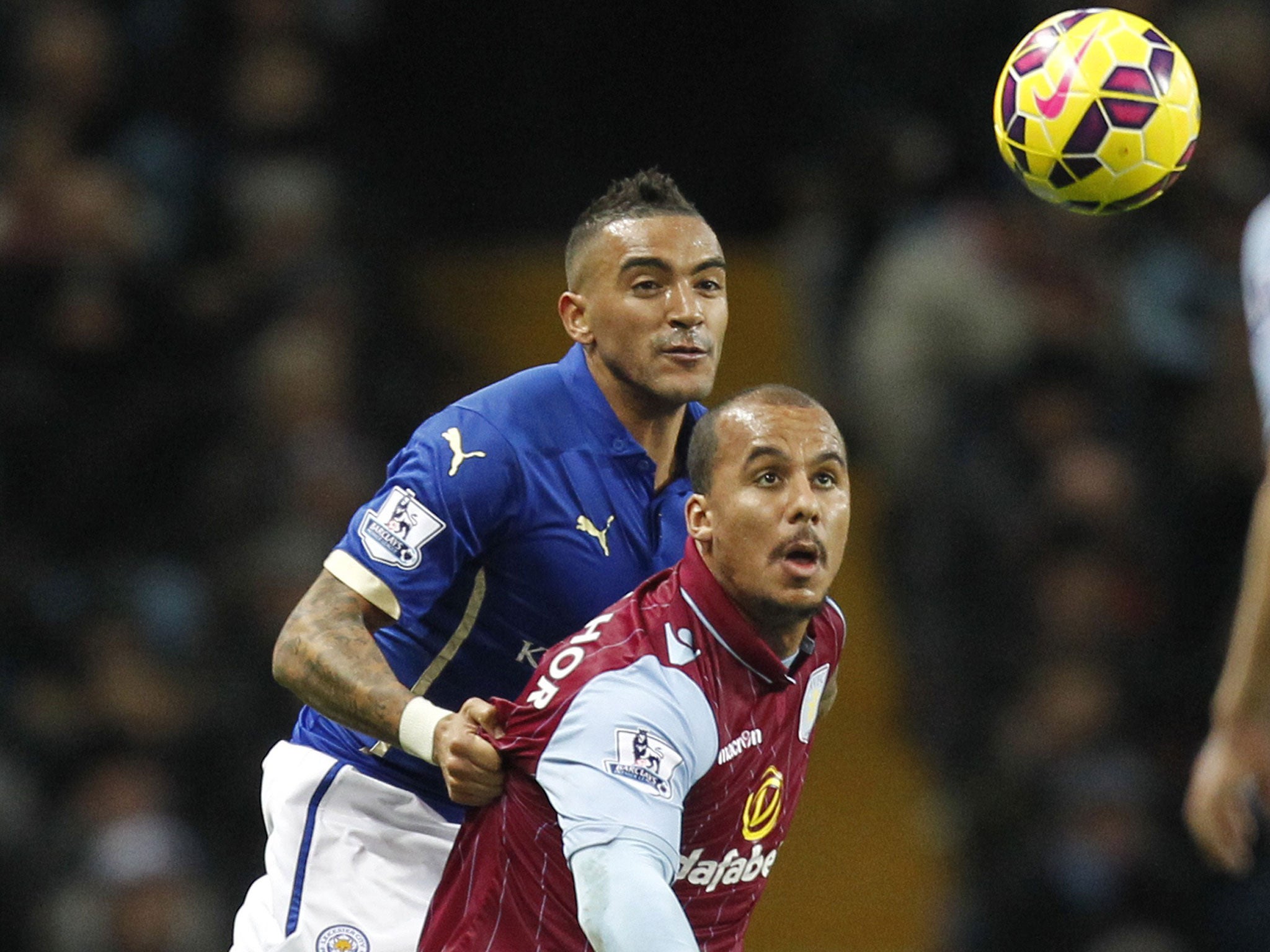 Aston Villa's Gabriel Agbonlahor competes with Leicester's Danny Simpson for the ball