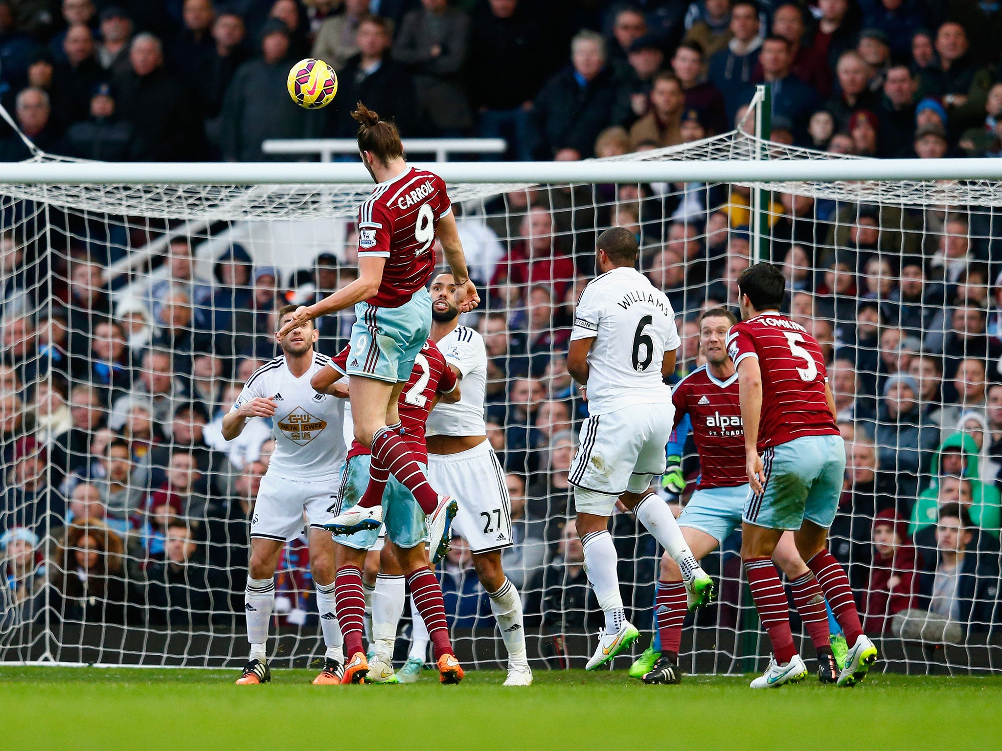 Andy Carroll heads in his second