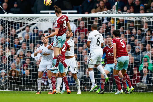 Andy Carroll heads in his second