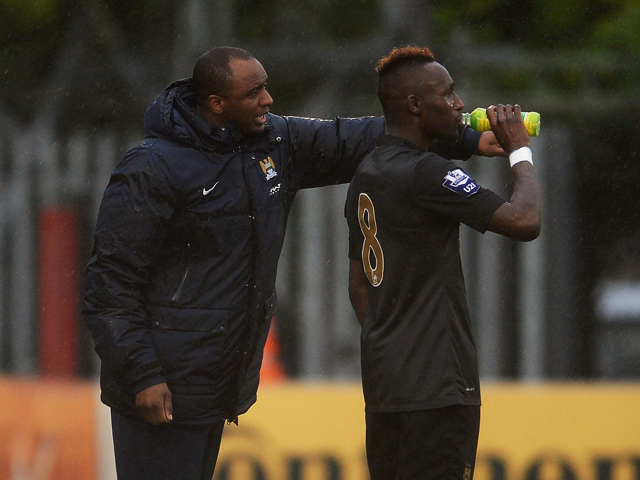 Manchester City Under-21 manager Patrick Vieira gives instructions to Seko Fofana