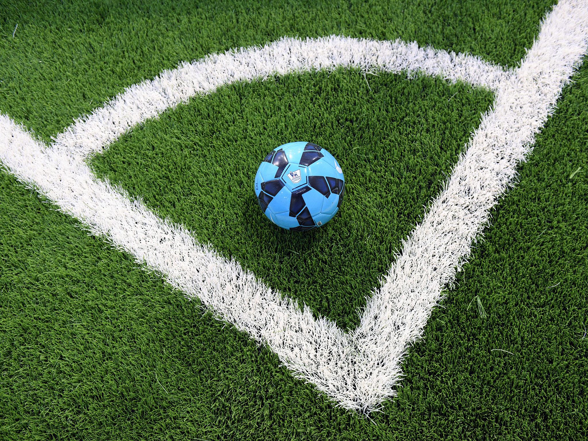 A Premier League-branded football is pictured on the indoor synthetic pitch in the performance centre