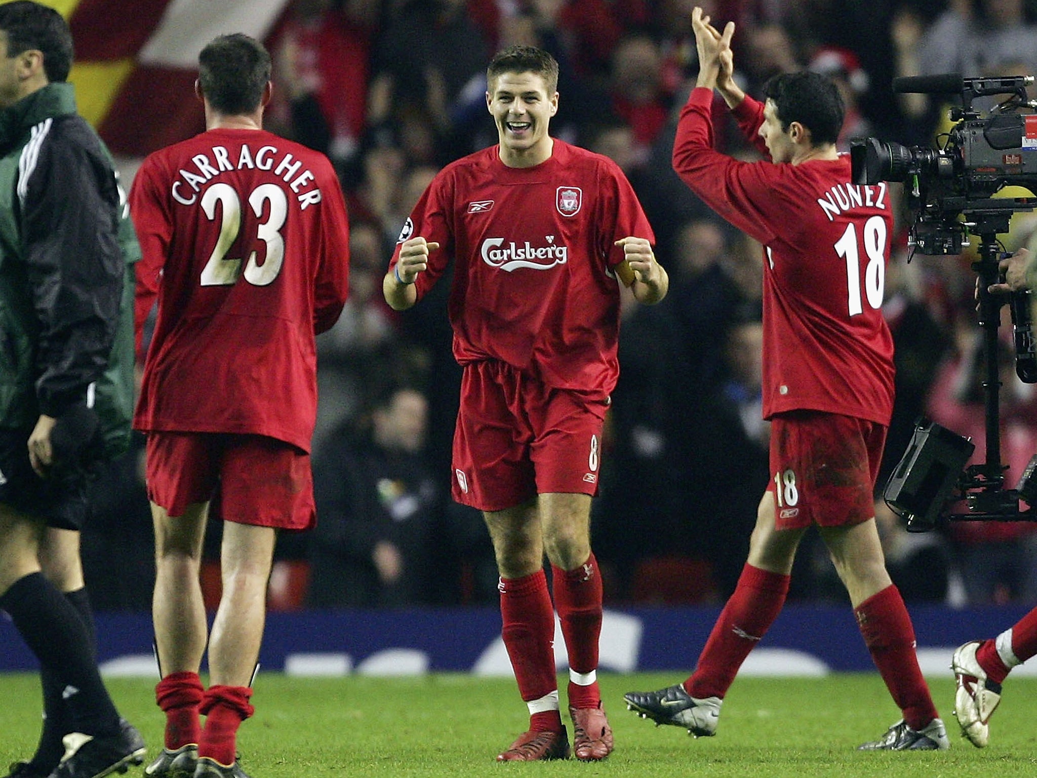 Steven Gerrard of Liverpool celebrates victory over Olympiakos with Jamie Carragher