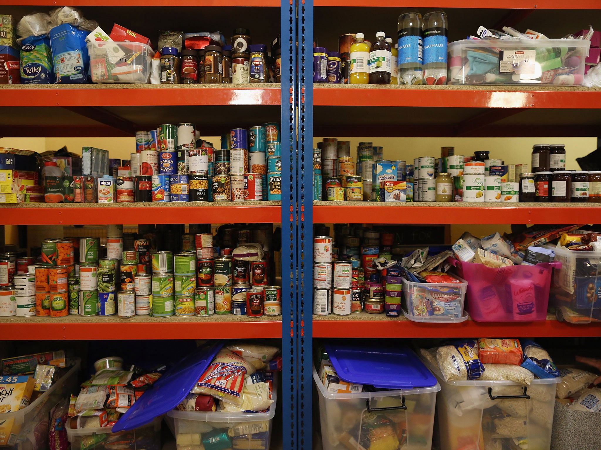 Food is stacked on shelving at a Food Bank depot at St. Paul's Church in Brixton 