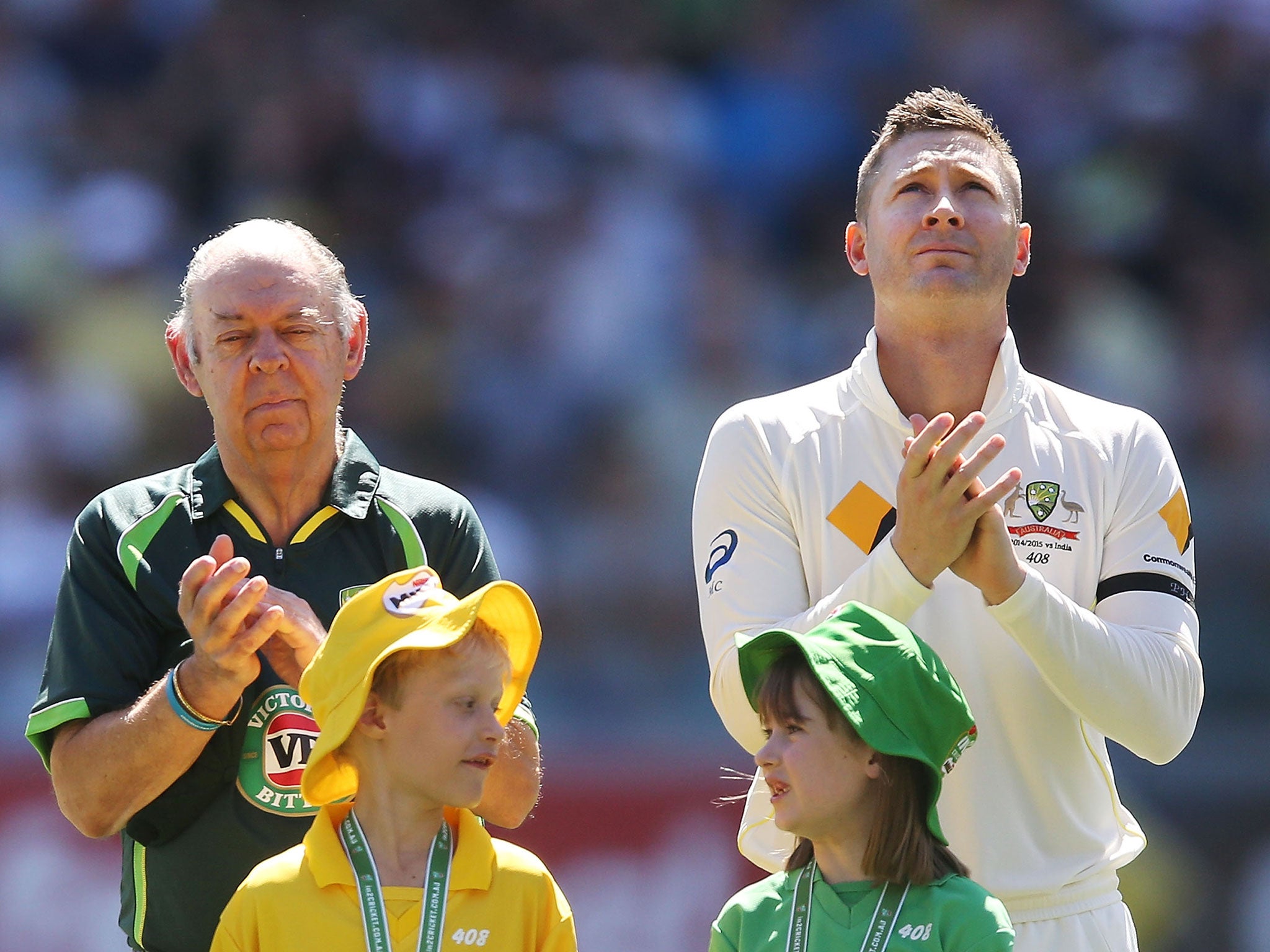 Barry Rees and Michael Clarke applaud in memory of Phillip Hughes