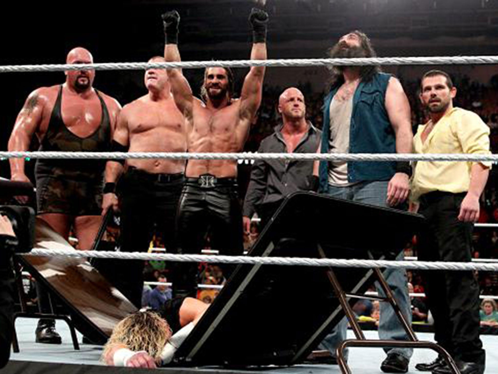 The Big Show, Kane, Seth Rollins, Joey Mercury, Luke Harper and Jamie Noble stand tall over Dolph Ziggler