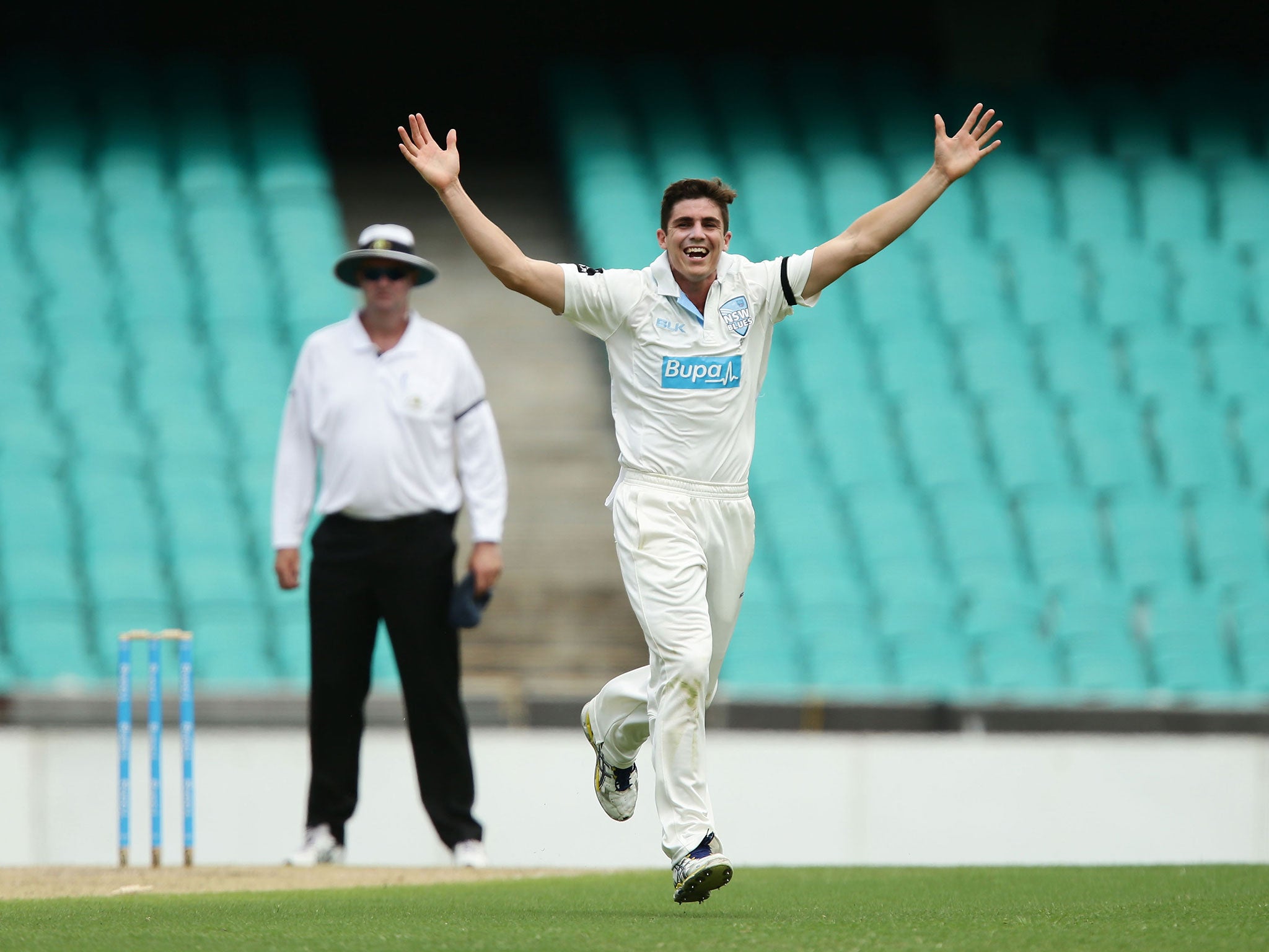 Sean Abbott celebrates picking up a wicket in the match between New South Wales and Queensland