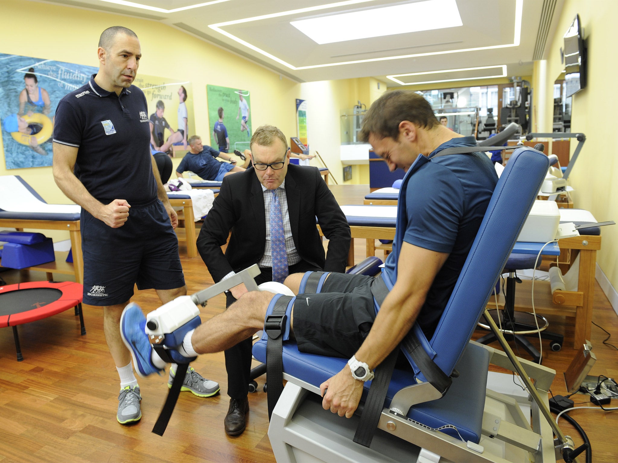 Phil Batty with Harley Street colleague Marco Zanobbi working with Leyton Orient footballer Gary Sawyer