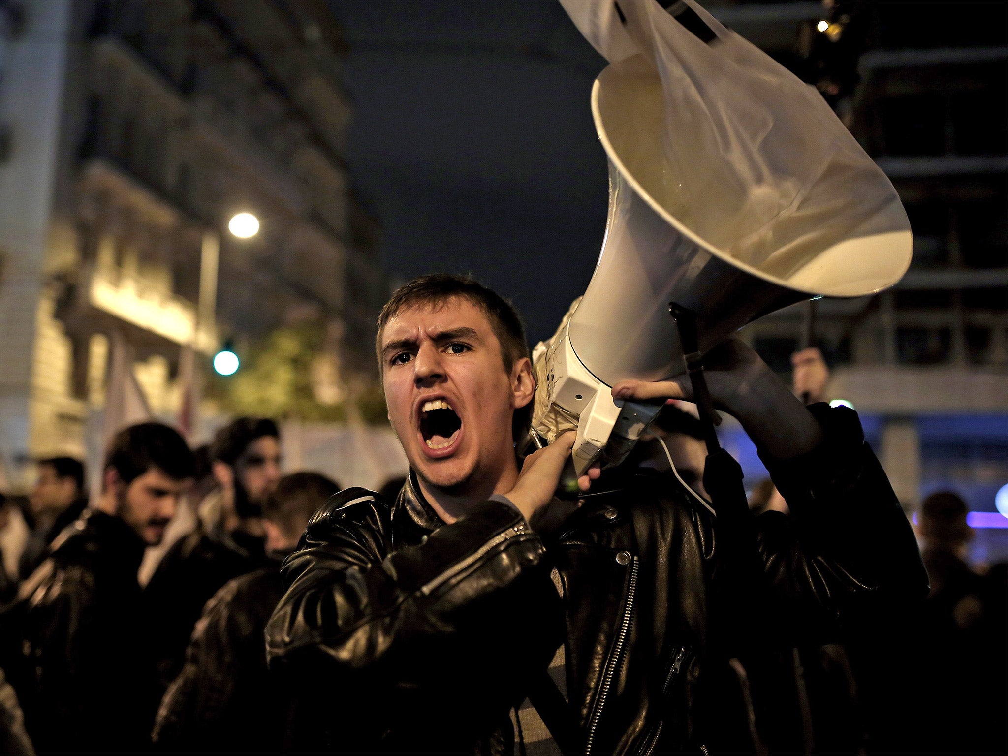 A protester shouts anti-government slogans during a demonstration outside the parliament in Athens this week, ahead of a budget vote and the end of the EU’s bailout programme this month