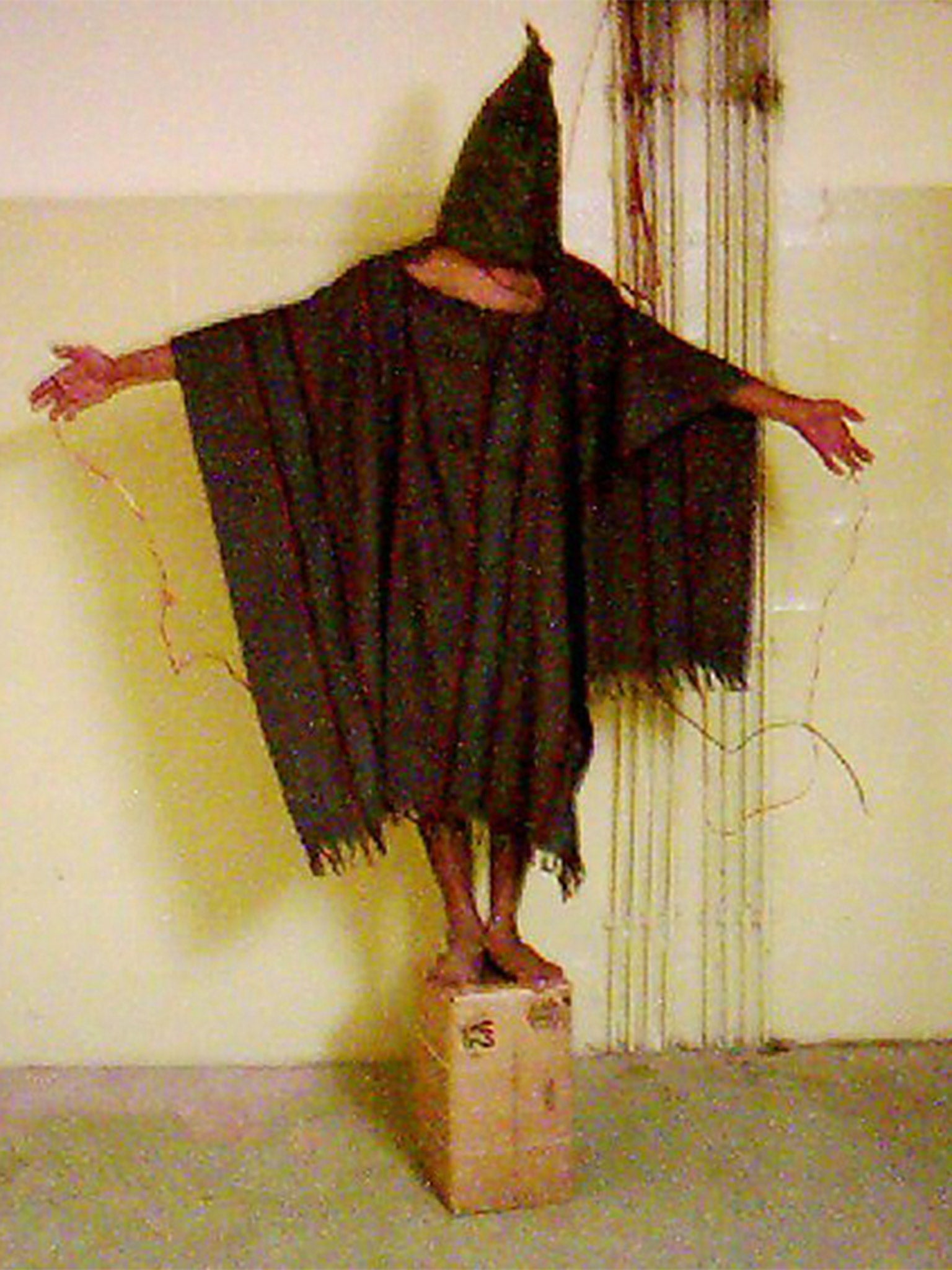 A detainee with wires attached to him in Abu Ghraib prison in Baghdad in 2003