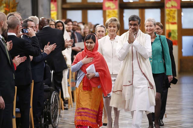 Malala Yousafzai and Kailash Satyarthi at Oslo City Hall to receive the Nobel Peace Prize