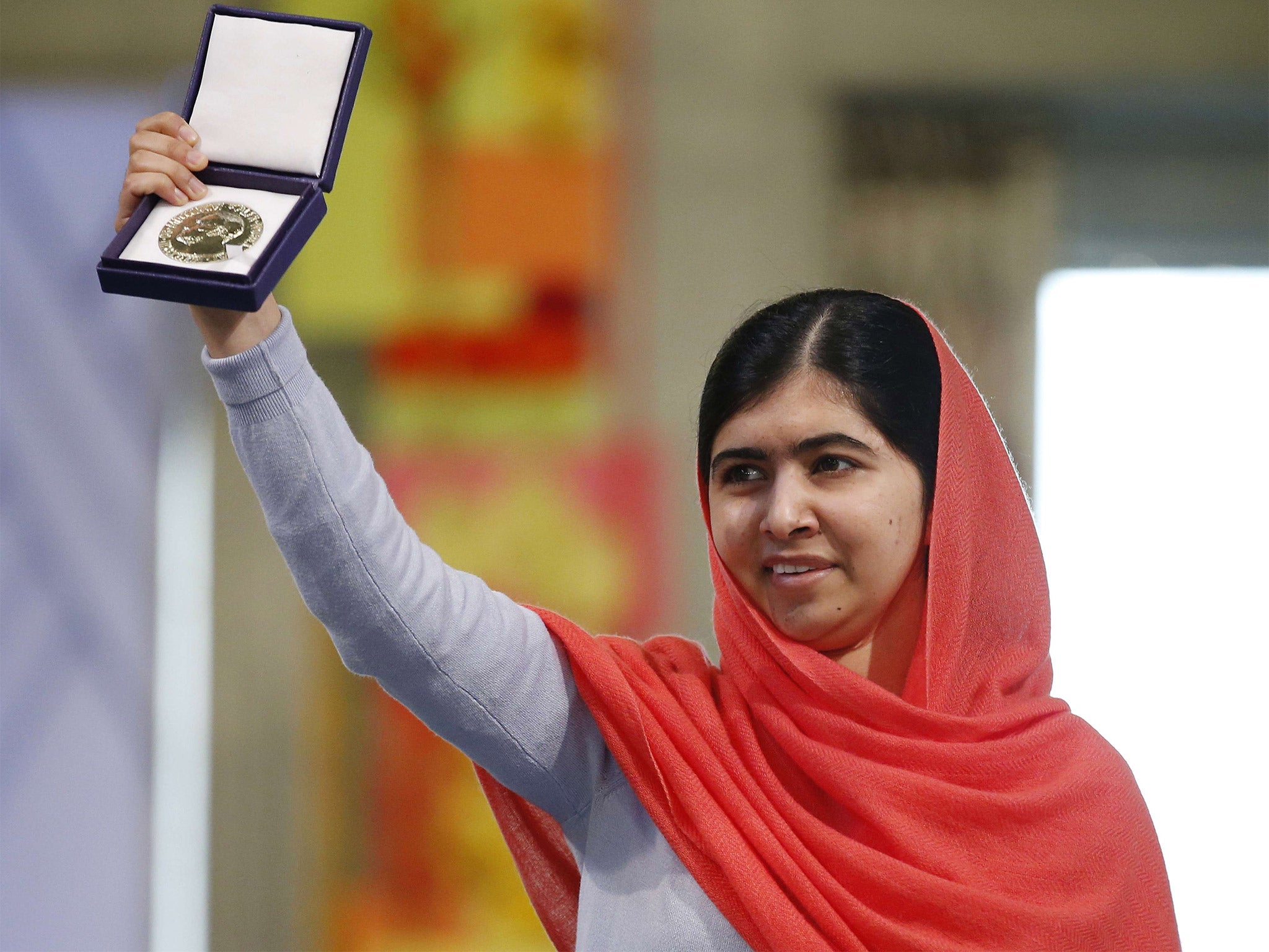 Nobel Peace Prize laureate Malala Yousafzai displays her medal