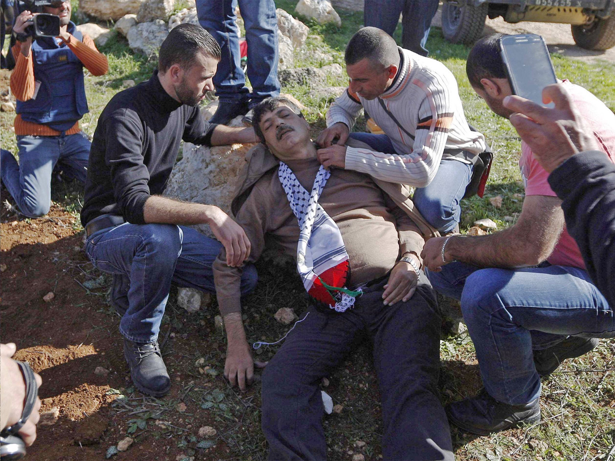 Ziad Abu Ein lying injured after he was in an altercation with Israeli troops