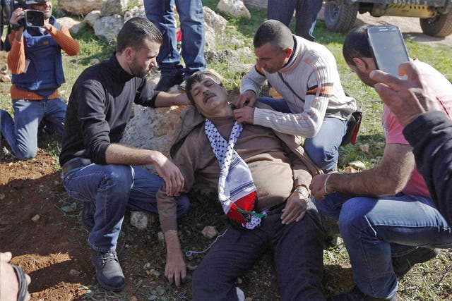 Ziad Abu Ein lying injured after he was in an altercation with Israeli troops 
