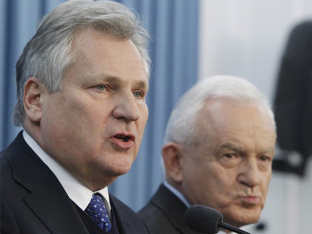 Former President Aleskander Kwasniewski, left, and former Prime Minister Leszek Mille were in power when the CIA ran a secret prison in Poland