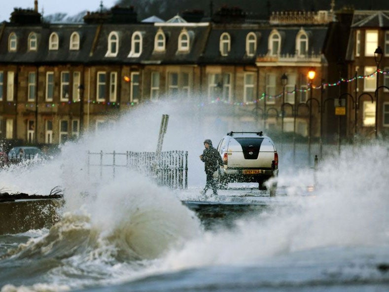 A man on the sea front in Largs, Scotland, as Britain is battered by a "weather bomb". (PA)