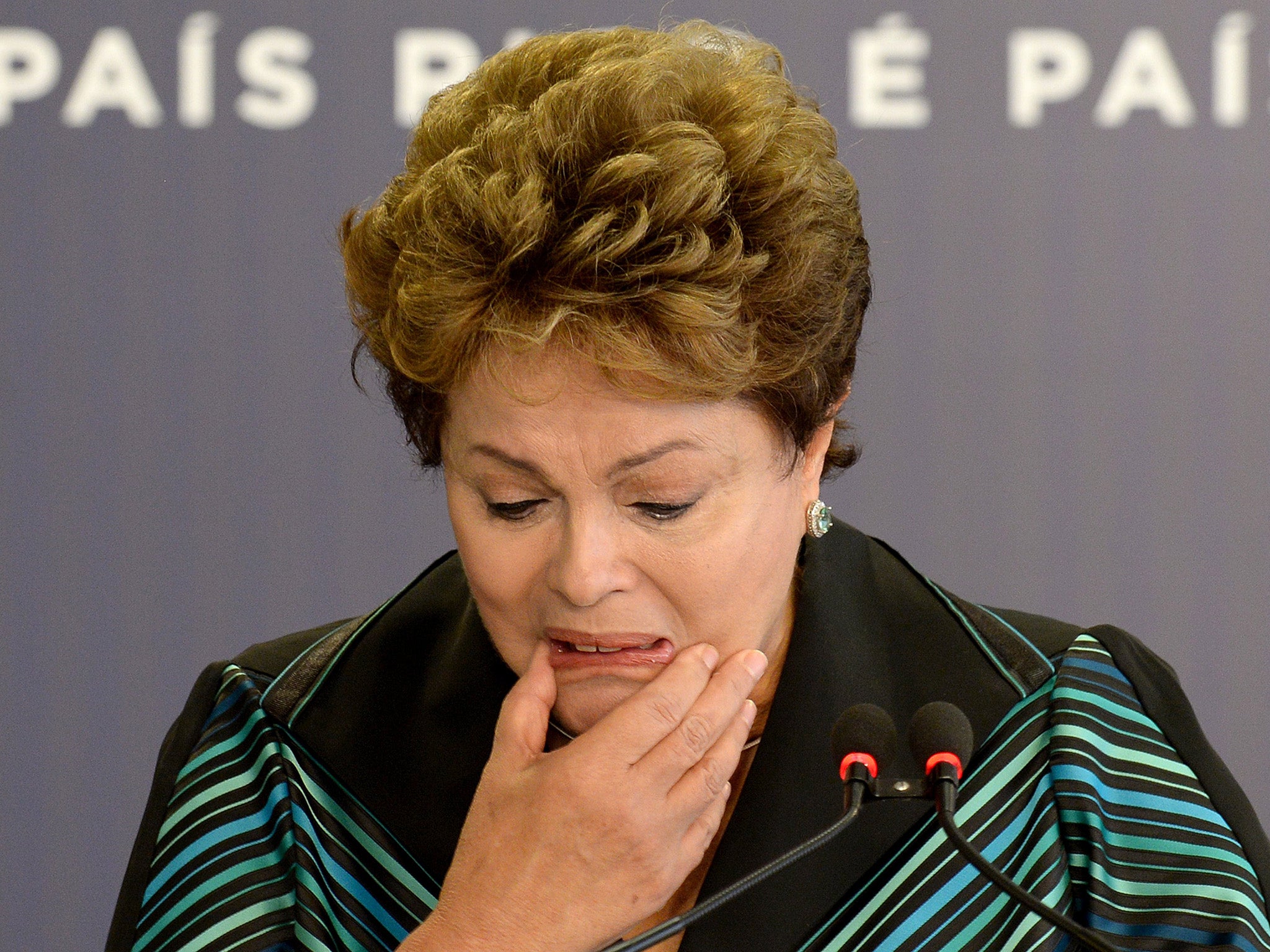 Brazilian President Dilma Rousseff cries while delivering a speech.