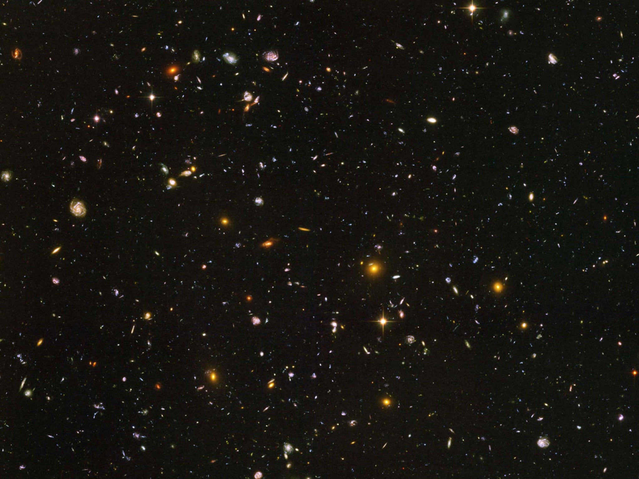 A photo from one of Hubble's deepest looks into the visible universe, showing some of the first galaxies created during the Big Bang. Photo: NASA/ESA/S. Beckwith(STScI) and The HUDF Team