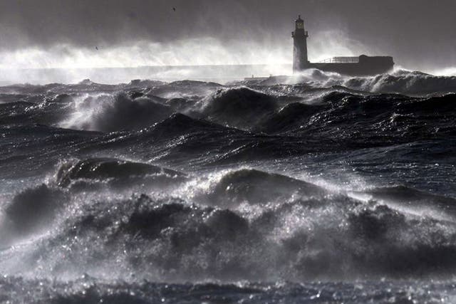 Giant waves hit the lighthouse wall at Whitehaven, as the stormy weather is causing disruption across parts of the UK with power cuts, ferry and train cancellations and difficult driving conditions. PRESS ASSOCIATION Photo. Picture date: Wednesday Decembe