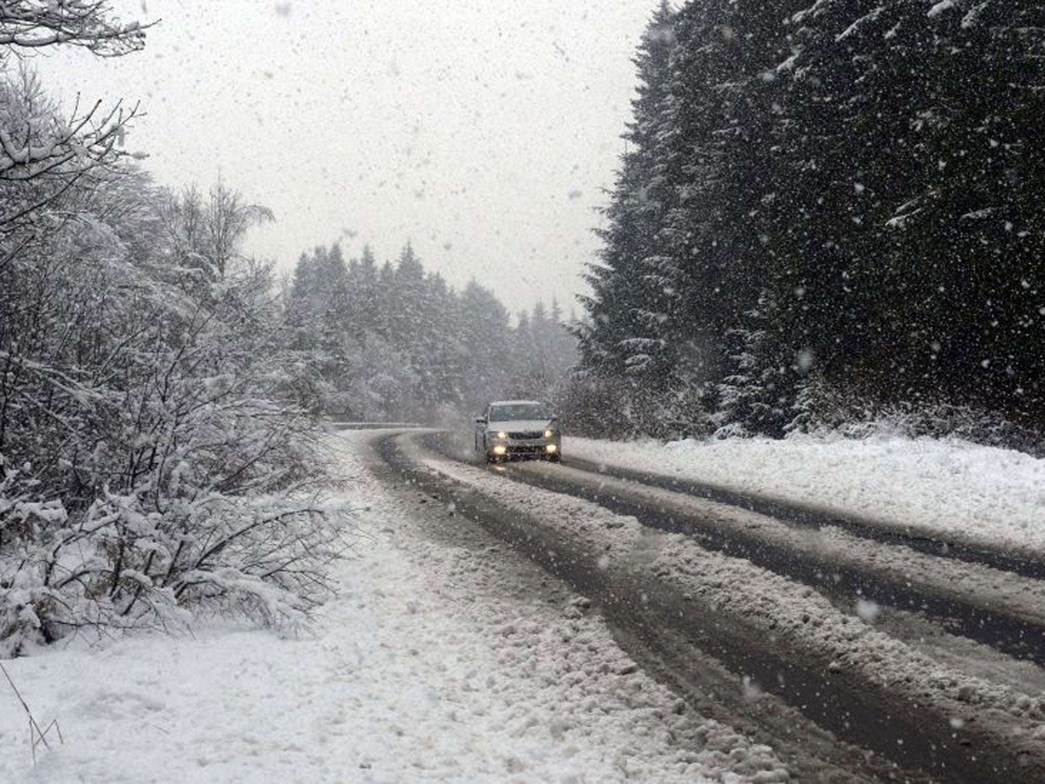 A car drives down the main road to Kielder in Northumberland