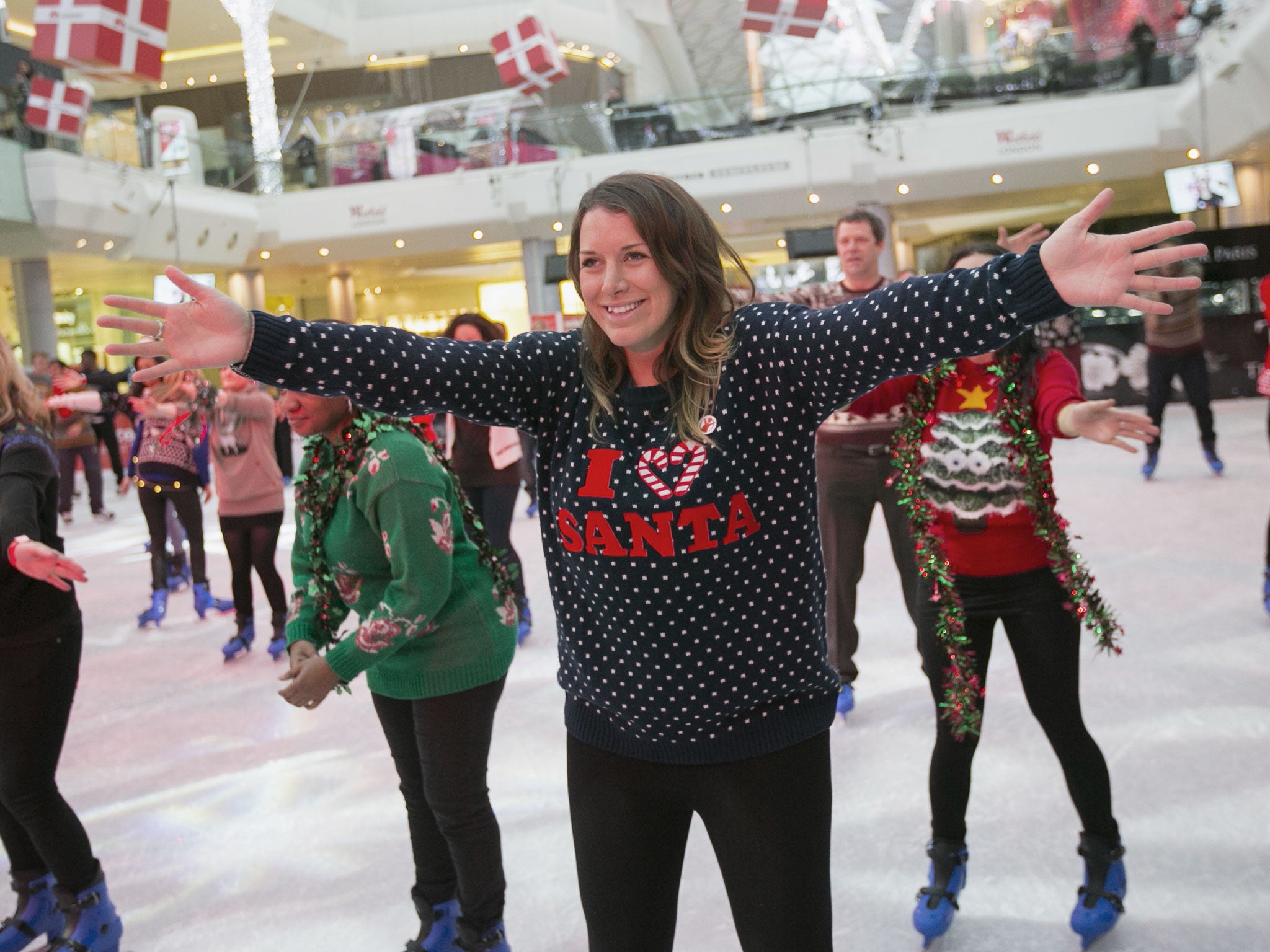 A woman takes part in an attempt to break the world record for the most people wearing Christmas jumpers on December 13, 2013 in London, England