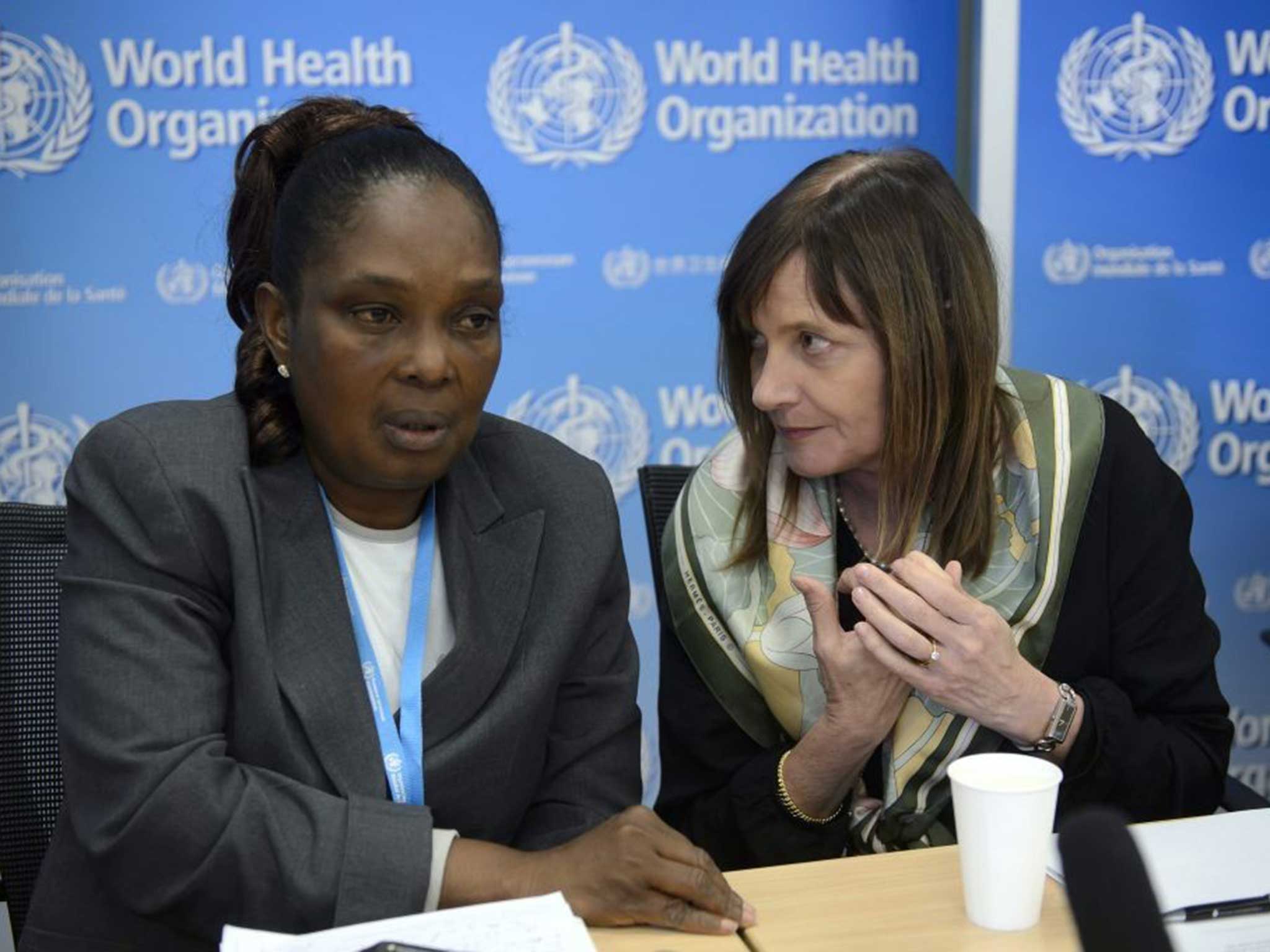 Liberia's Chief Medical Officer Bernice Dahn (L) and WHO Assistant Director General Marie-Paule Kieny (R) speak during a press conference