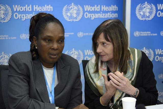 Liberia's Chief Medical Officer Bernice Dahn (L) and WHO Assistant Director General Marie-Paule Kieny (R) speak during a press conference 