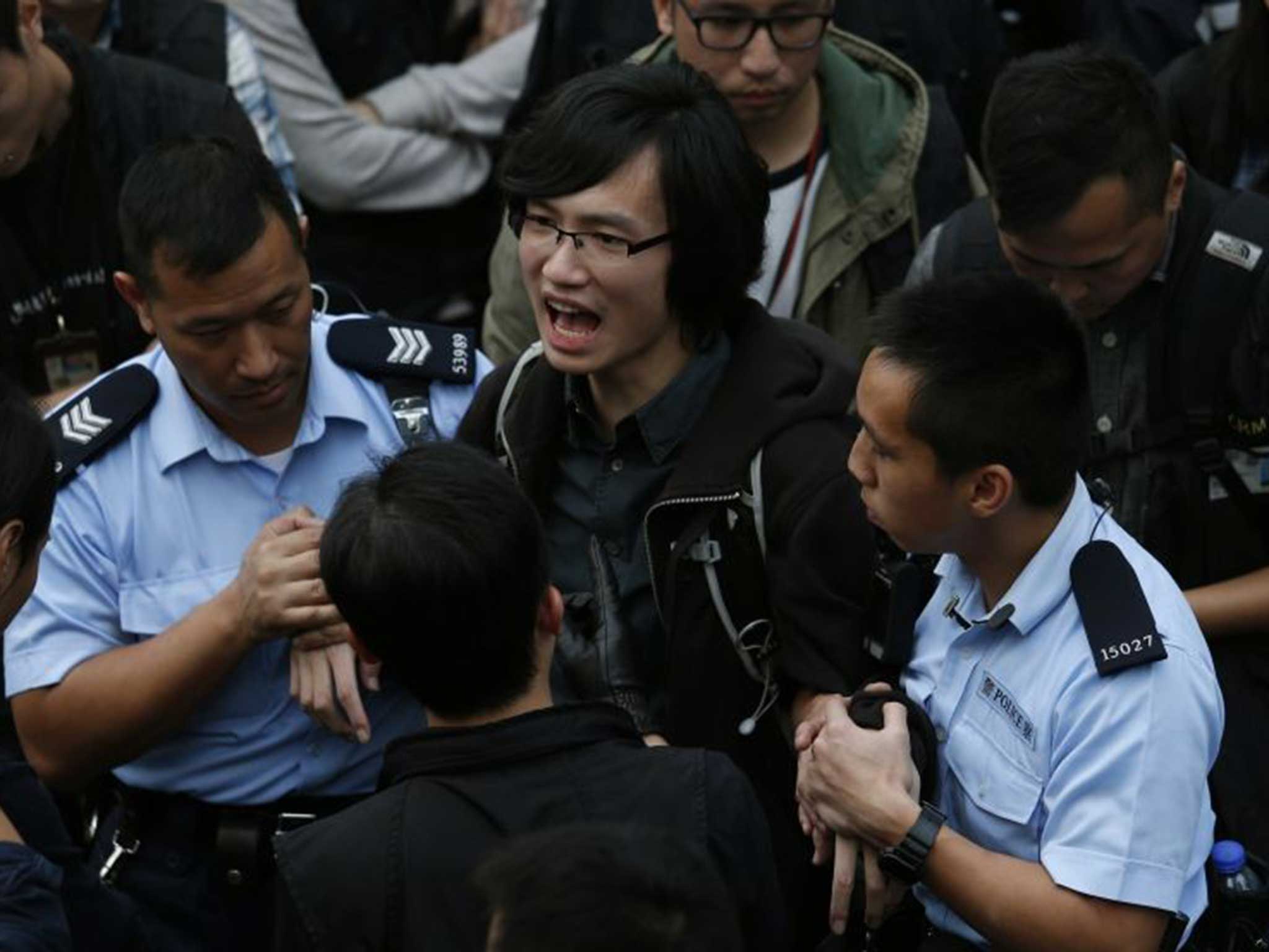 Police remove one of Hong Kong's 'Umbrella' protesters